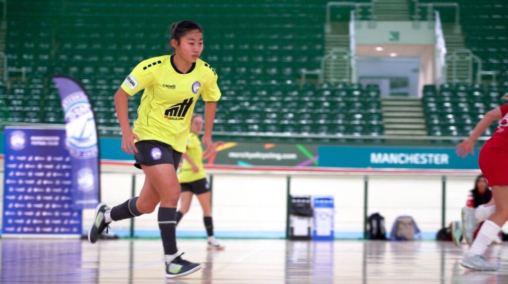 Women futsal player looking focussed during a match